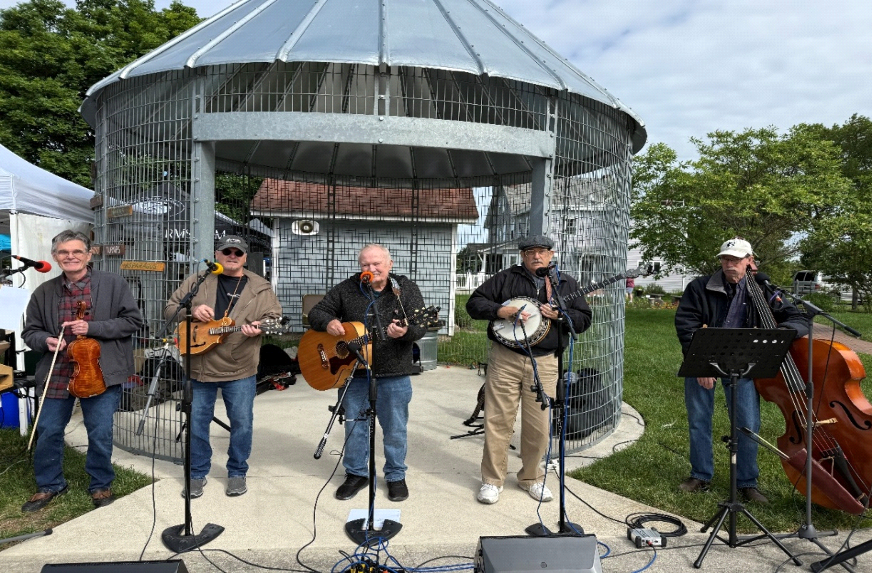 The Bad Dogz performing live outdoors at the beach club